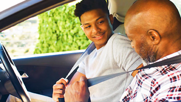 Father and son in car